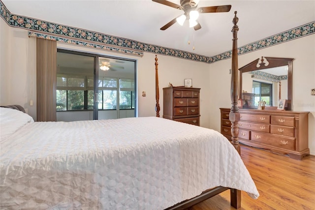 9835 Lakeshore Dr, Clermont, FL 34711 - bedroom with multiple windows, light wood-type flooring, and a ceiling fan