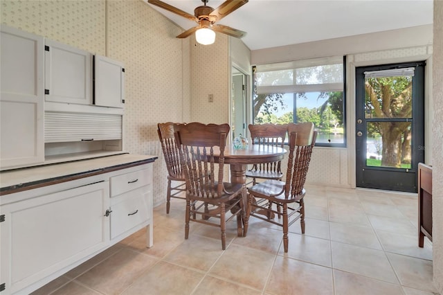 9835 Lakeshore Dr, Clermont, FL 34711 - dining room with wallpapered walls, a ceiling fan, and light tile patterned floors