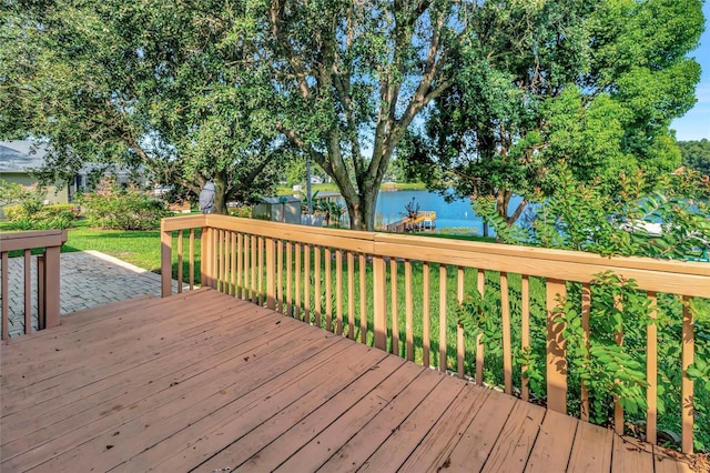 9835 Lakeshore Dr, Clermont, FL 34711 - wooden deck with a water view and a yard