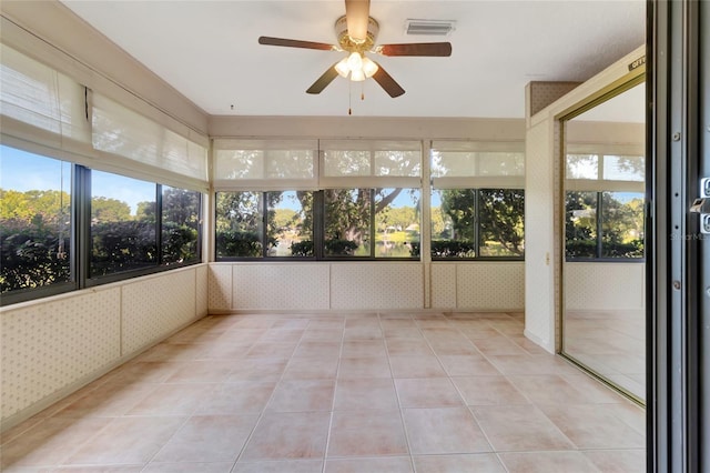 9835 Lakeshore Dr, Clermont, FL 34711 - unfurnished sunroom featuring ceiling fan