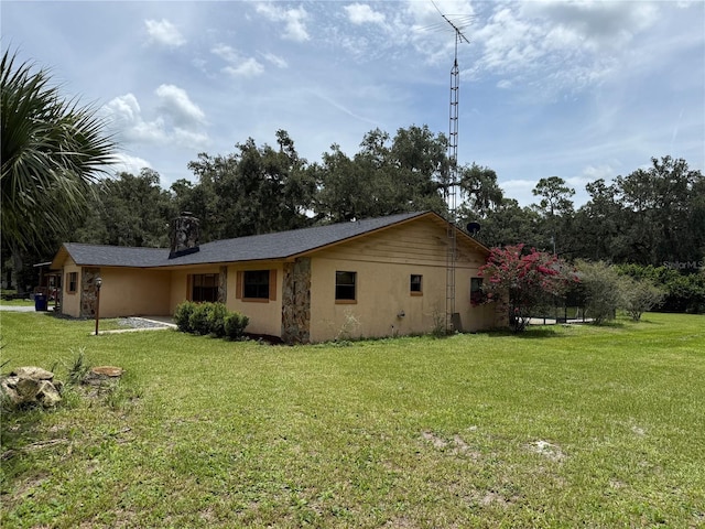 2747 County Road 615, Bushnell, FL 33513 - view of home's exterior featuring a yard and stucco siding