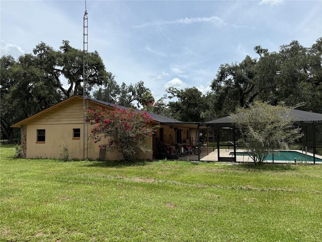 2747 County Road 615, Bushnell, FL 33513 - view of green lawn with an outdoor pool and a patio area