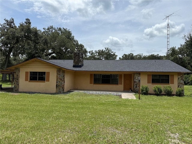 2747 County Road 615, Bushnell, FL 33513 - single story home featuring a front lawn, a chimney, stucco siding, and stone siding