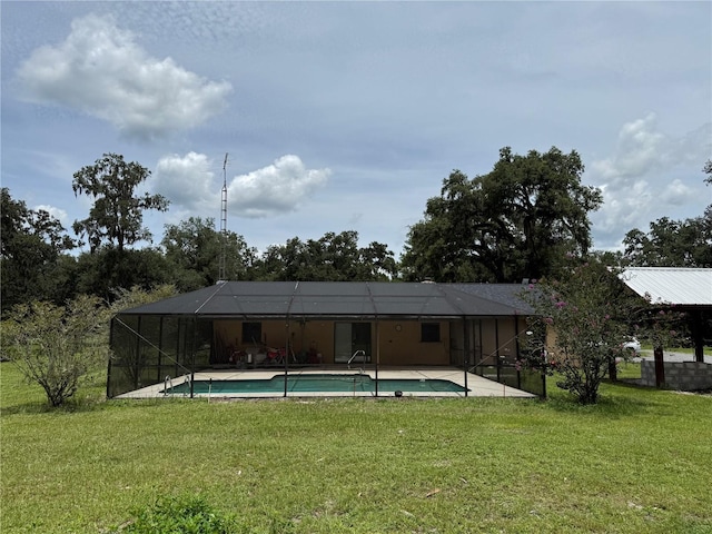 2747 County Road 615, Bushnell, FL 33513 - back of property with a lawn, an outdoor pool, a lanai, and a patio