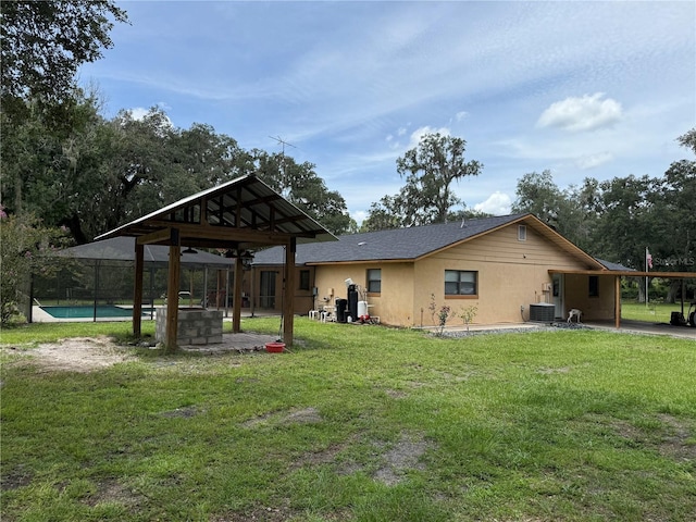 2747 County Road 615, Bushnell, FL 33513 - back of house with a lawn and stucco siding