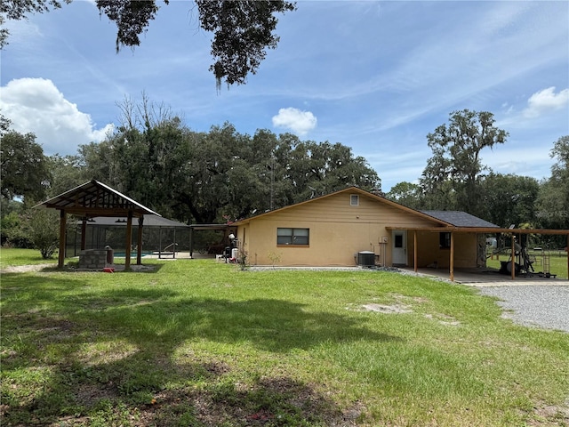 2747 County Road 615, Bushnell, FL 33513 - view of home's exterior with a lawn and view of scattered trees