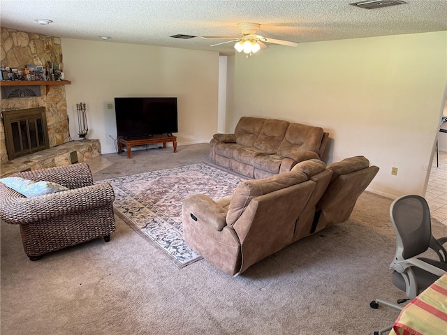 2747 County Road 615, Bushnell, FL 33513 - living area with carpet floors, a textured ceiling, ceiling fan, and a stone fireplace