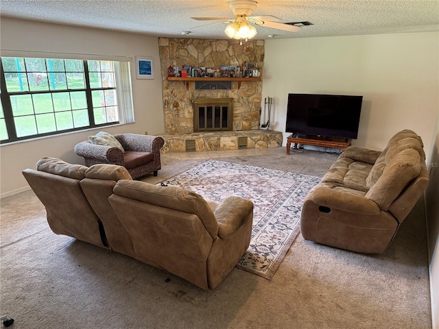 2747 County Road 615, Bushnell, FL 33513 - living area with a textured ceiling, ceiling fan, carpet floors, and a fireplace