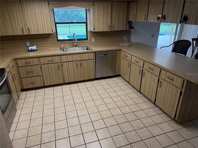 2747 County Road 615, Bushnell, FL 33513 - kitchen featuring dishwasher, light tile patterned floors, range, and light countertops