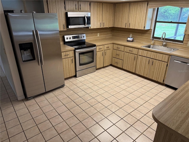2747 County Road 615, Bushnell, FL 33513 - kitchen with stainless steel appliances, light countertops, light tile patterned floors, and backsplash