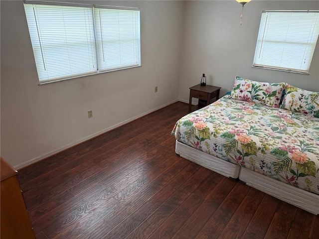 2747 County Road 615, Bushnell, FL 33513 - bedroom featuring dark wood-style floors and multiple windows