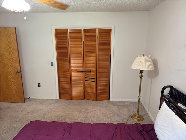 2747 County Road 615, Bushnell, FL 33513 - bedroom featuring carpet flooring, a closet, a textured ceiling, and ceiling fan