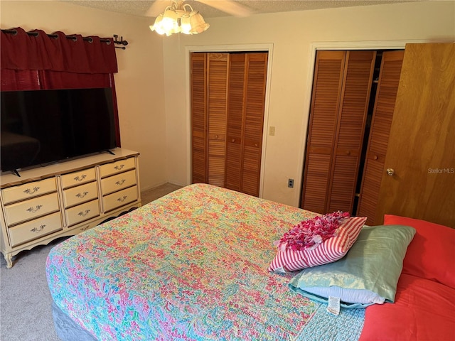2747 County Road 615, Bushnell, FL 33513 - bedroom with multiple closets, carpet, and a textured ceiling