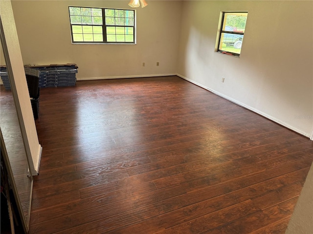 2747 County Road 615, Bushnell, FL 33513 - spare room featuring dark wood-type flooring and baseboards