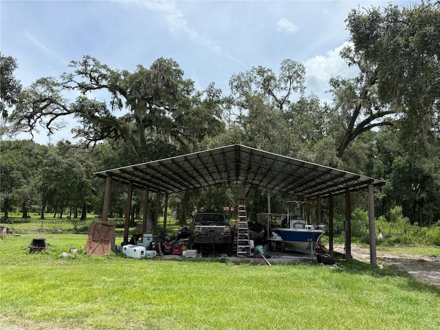 2747 County Road 615, Bushnell, FL 33513 - view of parking / parking lot featuring a carport and view of wooded area