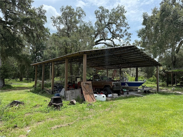 2747 County Road 615, Bushnell, FL 33513 - view of parking featuring a detached carport