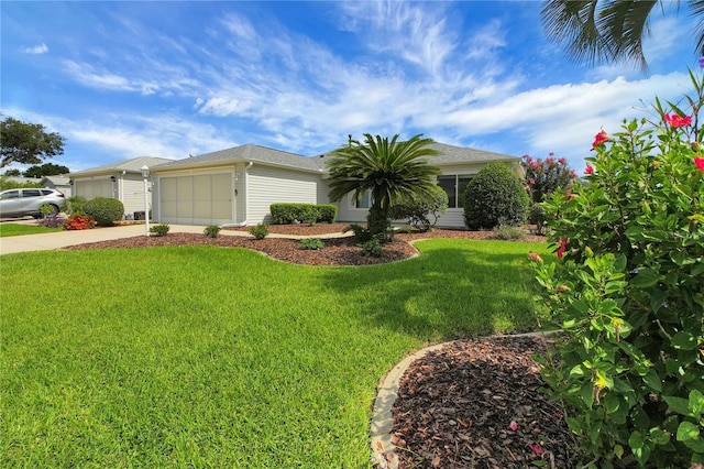 17707 SE 92nd Grantham Ter, The Villages, FL 32162 - view of front of home with a front yard, a garage, and driveway