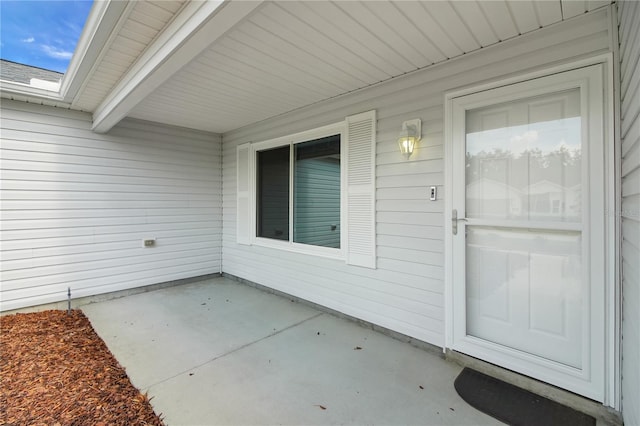 17707 SE 92nd Grantham Ter, The Villages, FL 32162 - doorway to property featuring a patio area