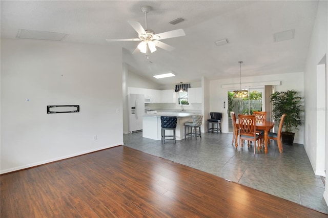 17707 SE 92nd Grantham Ter, The Villages, FL 32162 - dining space with ceiling fan, vaulted ceiling, and wood finished floors