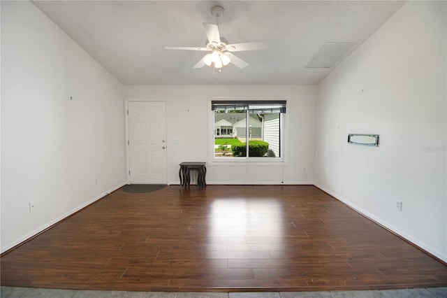 17707 SE 92nd Grantham Ter, The Villages, FL 32162 - unfurnished living room with wood finished floors, ceiling fan, and a textured ceiling