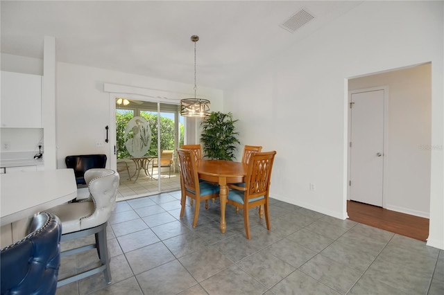 17707 SE 92nd Grantham Ter, The Villages, FL 32162 - dining room with light tile patterned floors and a chandelier