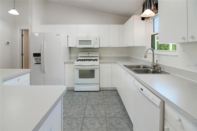 17707 SE 92nd Grantham Ter, The Villages, FL 32162 - kitchen featuring white appliances, lofted ceiling, white cabinetry, and light countertops