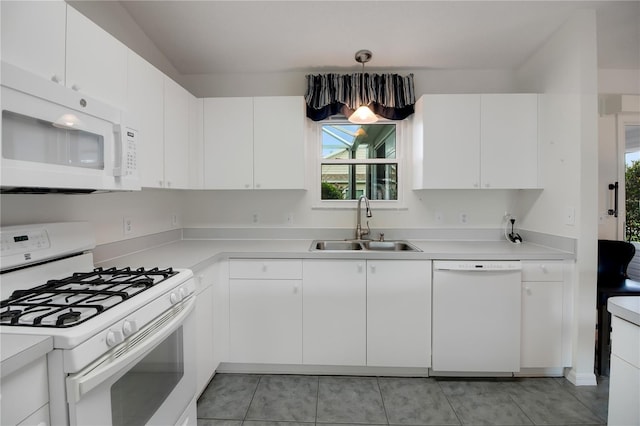17707 SE 92nd Grantham Ter, The Villages, FL 32162 - kitchen featuring white appliances, healthy amount of natural light, and light countertops