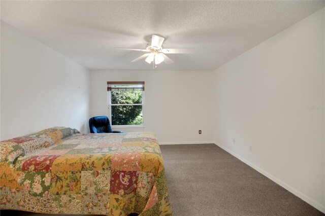 17707 SE 92nd Grantham Ter, The Villages, FL 32162 - bedroom featuring dark carpet, a textured ceiling, and ceiling fan