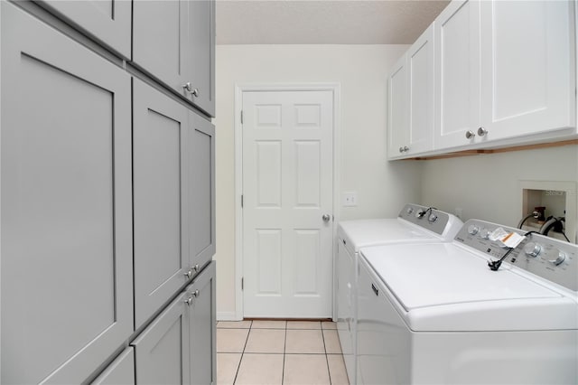 17707 SE 92nd Grantham Ter, The Villages, FL 32162 - washroom with cabinet space, independent washer and dryer, and light tile patterned flooring