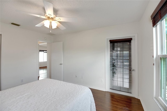 17707 SE 92nd Grantham Ter, The Villages, FL 32162 - unfurnished bedroom with dark wood-style flooring and ceiling fan