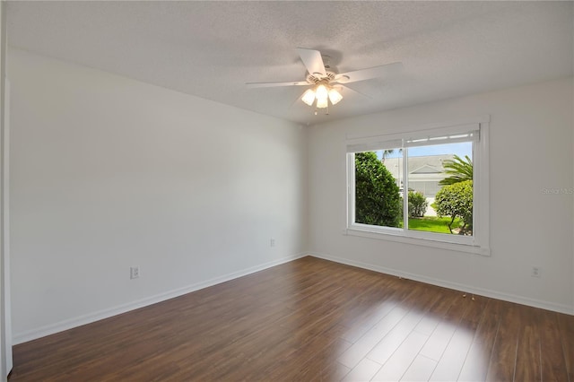 17707 SE 92nd Grantham Ter, The Villages, FL 32162 - empty room featuring dark wood-style floors, a ceiling fan, and a textured ceiling