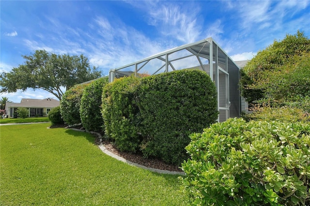 17707 SE 92nd Grantham Ter, The Villages, FL 32162 - view of side of property featuring a lawn and a lanai