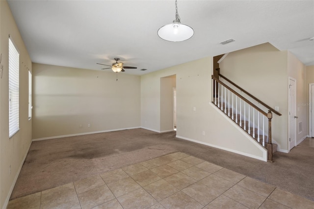 2215 Natoma Blvd, Mount Dora, FL 32757 - empty room featuring light carpet, ceiling fan, and stairs