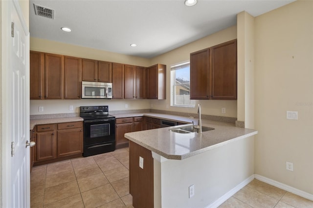 2215 Natoma Blvd, Mount Dora, FL 32757 - kitchen featuring stainless steel appliances, a peninsula, light countertops, recessed lighting, and light tile patterned floors