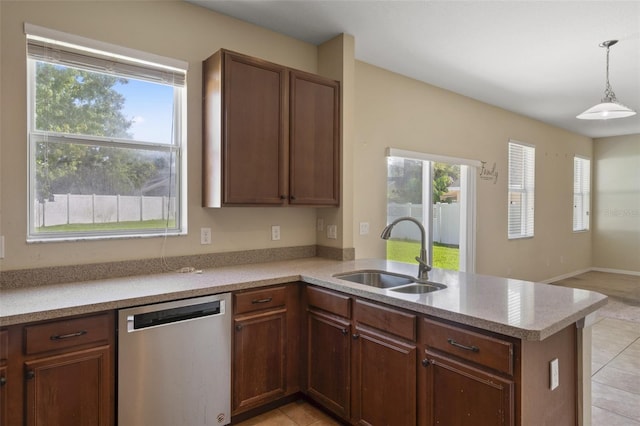 2215 Natoma Blvd, Mount Dora, FL 32757 - kitchen featuring stainless steel dishwasher, a peninsula, light countertops, and healthy amount of natural light