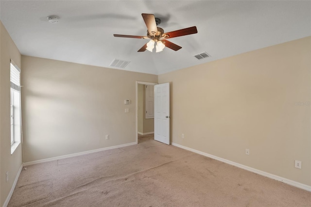 2215 Natoma Blvd, Mount Dora, FL 32757 - spare room featuring a smoke detector, a ceiling fan, and light colored carpet