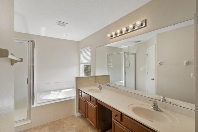 2215 Natoma Blvd, Mount Dora, FL 32757 - full bathroom featuring a stall shower, a bath, double vanity, and tile patterned flooring