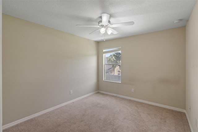2215 Natoma Blvd, Mount Dora, FL 32757 - spare room featuring light colored carpet, a ceiling fan, a textured ceiling, and a smoke detector