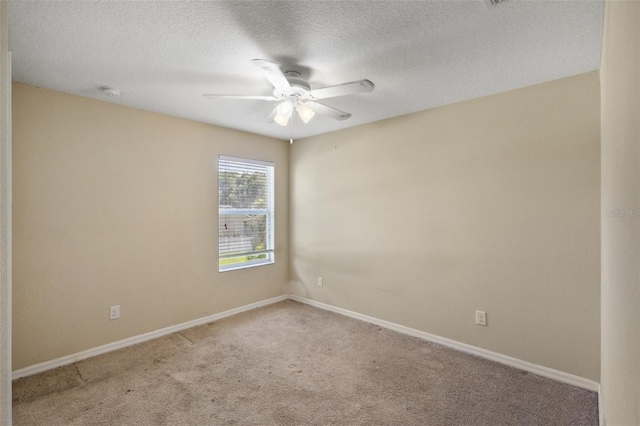 2215 Natoma Blvd, Mount Dora, FL 32757 - unfurnished room featuring a ceiling fan, light carpet, a textured ceiling, and a smoke detector