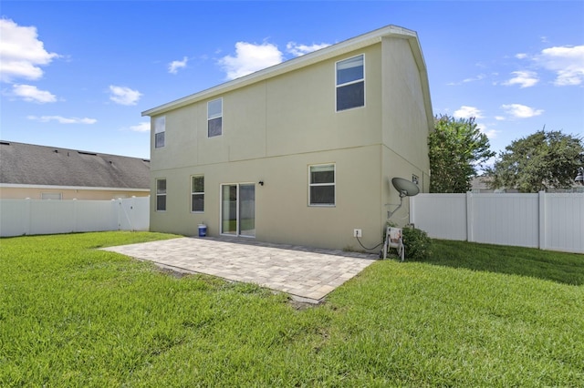 2215 Natoma Blvd, Mount Dora, FL 32757 - rear view of house with stucco siding, a patio, and a fenced backyard