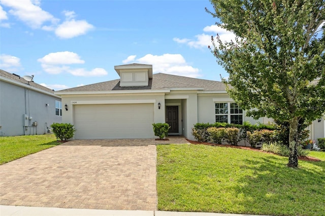 1504 Finchburg St, Minneola, FL 34715 - ranch-style house featuring an attached garage, decorative driveway, a front yard, and stucco siding