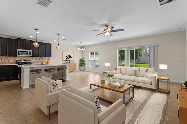 1504 Finchburg St, Minneola, FL 34715 - living room featuring ceiling fan, light tile patterned floors, and recessed lighting