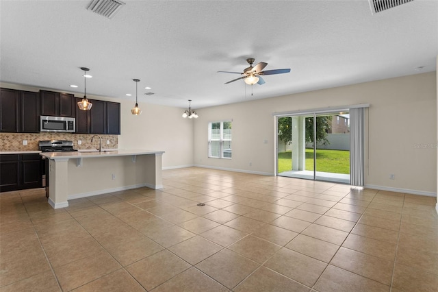 1504 Finchburg St, Minneola, FL 34715 - unfurnished living room with light tile patterned floors, ceiling fan, and recessed lighting