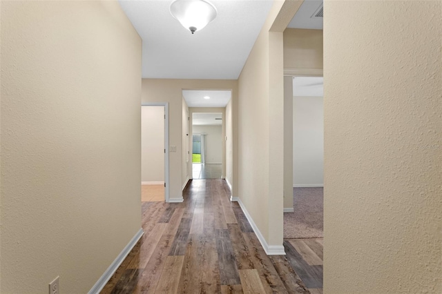 1504 Finchburg St, Minneola, FL 34715 - hallway featuring dark wood-type flooring and a textured wall