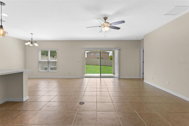 1504 Finchburg St, Minneola, FL 34715 - tiled empty room with healthy amount of natural light, a ceiling fan, and a chandelier