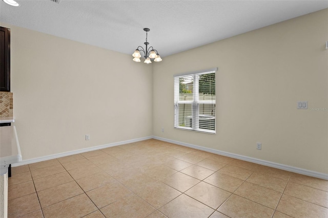 1504 Finchburg St, Minneola, FL 34715 - unfurnished dining area featuring light tile patterned floors and a chandelier