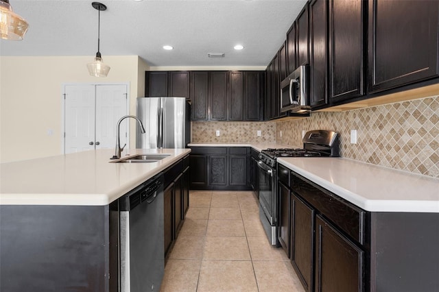 1504 Finchburg St, Minneola, FL 34715 - kitchen featuring appliances with stainless steel finishes, light countertops, light tile patterned floors, backsplash, and recessed lighting