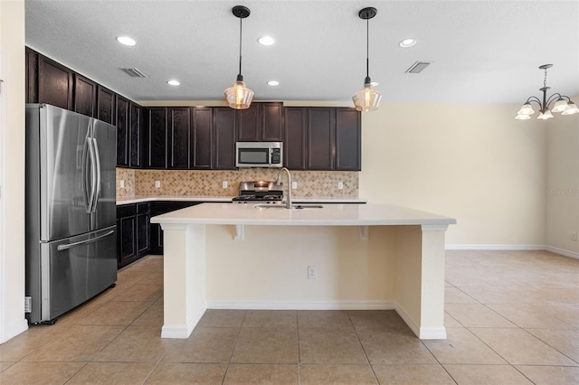 1504 Finchburg St, Minneola, FL 34715 - kitchen with stainless steel appliances, light tile patterned flooring, light countertops, backsplash, and recessed lighting