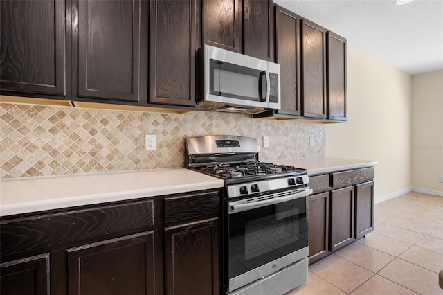 1504 Finchburg St, Minneola, FL 34715 - kitchen featuring stainless steel appliances, light tile patterned floors, backsplash, and light countertops