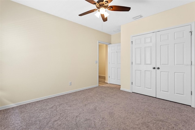 1504 Finchburg St, Minneola, FL 34715 - unfurnished bedroom with light colored carpet, a closet, and a ceiling fan